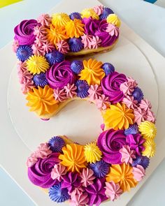 the letter s is made out of cupcakes and icing