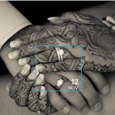 two hands holding each other with the number 12 on it's fingers and wedding rings in front of them