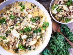 two bowls filled with food sitting on top of a table next to broccoli