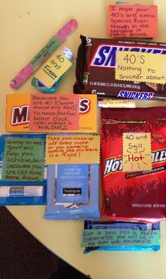 several candy bars are on a table with writing on them, including one for hot chocolate and the other for marshmallows