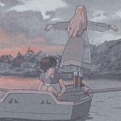 two children in a boat with an adult standing on the back and another child sitting behind them