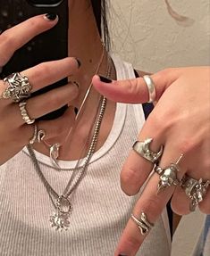 a woman with multiple rings on her fingers