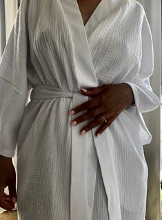 This bathrobe was designed for women who value comfort and love natural fabrics. Cotton kimono made of muslin will warm you in winter and cool you in summer. The fabric is wonderfully soft. I wanted the robe to act as a dress, so you can wear it all day. In one product, I combined several functions to help build a conscious wardrobe. One size kimono Rose-colored kimono GOTS certified natural cotton kimono This bathrobe was created for women who value comfort and love natural fabrics. A cotton ki Spring Cotton Robe For Relaxation, Spring Relaxation Cotton Robe, Cotton Kimono For Lounging, Spring Cotton Kimono For Lounging, Cotton Kimono For Spring Lounging, Wrap Robe For Relaxation In Spring, Summer Sleep Robe In Wrap Style, Long Summer Robe For Lounging, Long Summer Lounging Robe