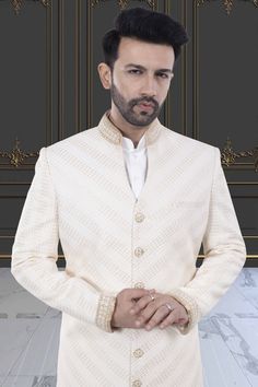 Stay stylishly cool with our Mens Sherwani featuring an open collar. Perfect for any occasion, this Sherwani adds a touch of class to your ensemble. Upgrade your wardrobe now with R14-S77. Elegant Long Sleeve Nehru Jacket For Designer Wear, Elegant Nehru Jacket For Designer Wear And Eid, Elegant Nehru Jacket For Eid Designer Wear, Elegant Designer Outerwear For Eid, Formal White Nehru Jacket With Cutdana, Designer Semi-formal Kurta For Festive Occasions, Designer Festive Semi-formal Kurta, White Cutdana Bandhgala For Formal Occasions, White Cutdana Bandhgala For Formal Events