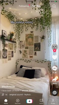 the bedroom is decorated in white and has plants growing on the wall above the bed