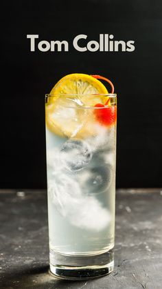 a tall glass filled with ice and lemon