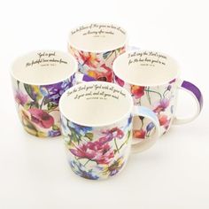 four coffee cups with floral designs and sayings on the bottom one cup has a purple band around it