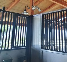 the inside of a horse stable with two stalls