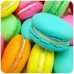 many different colored macaroons in a pile