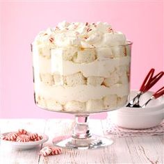 a cake with white frosting and candy canes