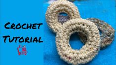 two crochet rings sitting next to each other on a blue surface with the words crochet tutor written below them