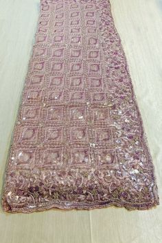 This Saree is Ready to Wear Effortlessly elegant, this Delightful Light Purple Color Sequins & Embroidery Net Saree is perfect for any party wear occasion. With intricate sequins and embroidery work in a beautiful light purple color, this saree will make you stand out in the crowd. Be the envy of everyone with this stunning outfit. About: Fabric Type: NetPrimary Color: Light PurpleSaree Length: 6.0 meters including 0.8 meter blouseBlouse Material: (Same as picture)Washing Instructions: Dry Clean Purple Pink Sarees With Sequins Pearls And Cut, Purple Net Saree, Festive Lavender Semi-stitched Saree, Purple Sequined Pre-draped Saree, Saree For Party Wear, Luxury Purple Sequined Pre-draped Saree, Purple Sequined Bollywood Pre-draped Saree, Saree For Party, Light Purple Color