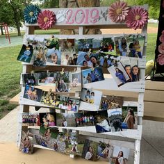 a wooden sign with pictures and flowers on it