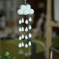 a wind chime with rain drops hanging from it