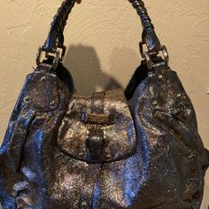 Elevate Your Style With This Stunning Halston Heritage Glitter Leather Handbag. Crafted With High-Quality Leather, This Hobo Bag Features A Multi-Color Exterior And A Black Lining. The Spacious Interior Provides Ample Room For Your Essentials, While The Leather Handle And Strap Provide Comfort And Durability.The Accents Of Glitter Add A Touch Of Glamour To This Gorgeous Bag. Its Large Size Makes It Perfect For Everyday Use Or Special Occasions. I Barely Used This Bag And It Has Been Stored In Its Bag In My Closet. Its More Of A Rose Gold And Bluish Sparkle Leather Color. Measurements Length-Approx 18 In Width- Approx 7 In Height- Approx 17 In Textured Leather Top Handle Bag For Party, Party Top Handle Bag In Textured Leather, Designer Metallic Evening Bags, Party Top Handle Bag With Textured Leather, Party Textured Leather Top Handle Bag, Luxury Textured Leather Party Bag, Party Bag With Textured Leather And Top Handle, Designer Double Handle Shoulder Bag For Party, Textured Leather Shoulder Bag For Party