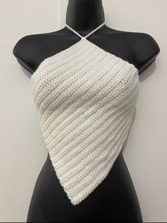 a mannequin wearing a white knitted halter top