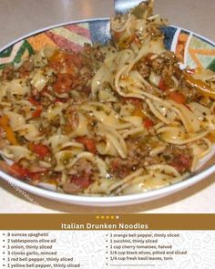 a bowl filled with pasta and meat on top of a table