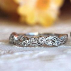 a close up of a wedding ring on a table