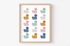 an art print with rubber ducks in pastel colors