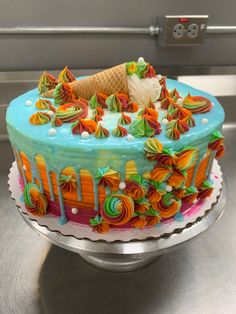 an ice cream cake decorated with colorful icing