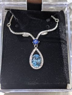 "Stones were examined by a certified gemologist. 14k options come with an apprisal letter choose from silver 14k plated with zircon as in pic or solid 14k with moissanite or natural diamonds. This Natural Blue Swiss topaz necklace is absolutely breathtaking. The blue topaz gem are set in 4 prong setting allowing a small pocket of light to shine through. Making these blue topaz earrings shine and sparkle with amazing luster.  The halo and ascent stones give this beautiful necklace extra shine and Africa Necklace, Blue Topaz Necklace, Blue Topaz Pendant, Topaz Pendant, Topaz Necklace, Blue Topaz Earrings, Sparkly Earrings, Topaz Earrings, Mystic Topaz