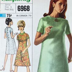 a woman in a green dress is standing next to an advertisement for the sewing pattern