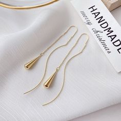 Add a touch of elegance to your look with these stunning Golden Teardrop Tassel Earrings. Graceful and chic, these earrings are the perfect addition to your wardrobe. Gold-plated High-quality zinc alloy Size: 3.5in Thread through style Hypoallergenic, lead & nickel free If you aren't in LOVE with your purchase, please let us know within 30 days of receiving your item, and you'll receive a stress-free refund. Big Dangle Earrings, Thread Chains, Unusual Earrings, Silver Drop Earrings, Mua Sắm, Heart Beads, Drop Pendant, Summer Jewelry, Beaded Pendant