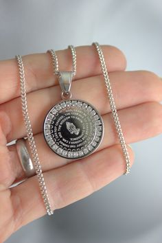 "This is a stainless steel pendant necklace for men in gold or silver. This beautiful round pendant measures 29x25mm, 2mm thick and comes on a 2mm curb chain with lobster clasp. Both the pendant and the chain are stainless steal. Pendant features CZ crystals that surround the \"The Serenity Prayer\" that is etched in a circular fashion around a set of praying hands. This is a real special pendant! A great reminder for those seeking help with addiction or just life in general. Comes in many lengt Spiritual Stainless Steel Necklaces For Father's Day, Spiritual Stainless Steel Necklace For Father's Day, Spiritual Stainless Steel Necklaces For Anniversary, Spiritual Stainless Steel Necklace For Anniversary, Stainless Steel Round Pendant Necklace For Father's Day, Stainless Steel Dog Tag Necklace For Anniversary, Anniversary Stainless Steel Dog Tag Necklace, Chain Necklace Men, 14kt Gold Jewelry