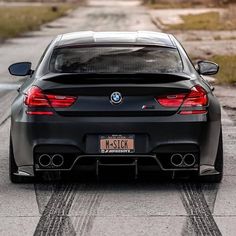 the back end of a black bmw car