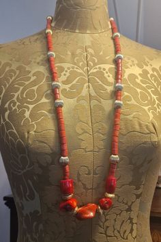 Magnificent long necklace made of real coral beads and gold-filled beads. The clasp is also gold-filled. Its length allows it to be worn in a single or double wrap. Elegant Orange Hand-strung Necklace, Elegant Orange Red Coral Beads, Orange Beaded Necklace With Large Red Coral Beads, Orange Red Coral Beaded Necklaces With Large Beads, Elegant Hand-strung Red Beaded Necklaces, Elegant Red Hand-strung Beaded Necklaces, Orange Red Coral Beaded Necklace With Large Beads, Spiritual Orange Necklace Made Of Red Coral, Spiritual Orange Red Coral Necklace