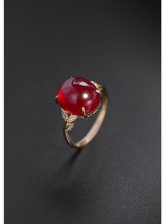 Luxury Ruby Ring With Gemstone Accents, Luxury Ruby Oval Cabochon Ring, Elegant Gold Gemstones With Accent Stones, Luxury Ruby Ring Oval Cabochon, Elegant Round Cut Ruby Ring Gift, Fine Jewelry Ruby Gemstones With Accents, Elegant Red Diamond Gemstones, Timeless Jewelry With Gemstone And Round Band, Timeless Gemstone Jewelry With Round Band