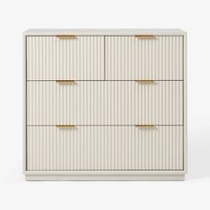 a white dresser with four drawers and gold pulls on the bottom drawer, against a white background