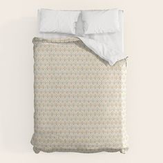 an image of a bed with white sheets and pillowcases on top of it