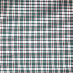 a green and white plaid fabric with small red dots on the bottom right half of it