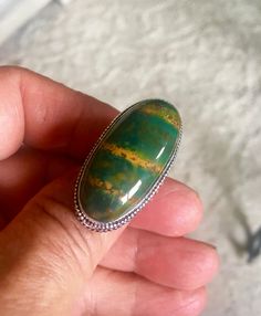 This is a beautiful very unique vintage Dragon bloodstone ring that if full AMAZING COLOR and DESIGN (see photo's). It is so unique with the red spots on the green. The shape is oval as seen in the photo's. The bloodstone gemstone is in very good vintage condition! The size is 9.5.  Base Metal: Sterling Silver plate with a copper base Ring Size: 8 (a hair over size 8 as seen in photo's) Style: Statement  Main Stone Creation: Natural Main Stone: Dragon Bloodstone Color: Green Secondary Color: Spe Unique Oval Opal Ring For Healing, Unique Oval Opal Ring With Large Stone, Dragon Bloodstone, Stone Dragon, Bloodstone Ring, Vintage Dragon, Over Size, 925 Silver Ring, Photo Styling