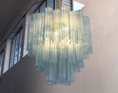 a glass chandelier hanging from the ceiling