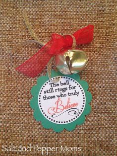 a bell ornament with a red ribbon on it and a message below the bell