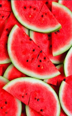 slices of watermelon are arranged on top of each other