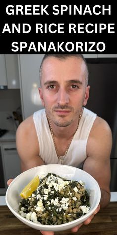 a man holding a white bowl filled with spinach and rice