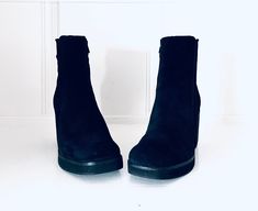 Super cute 90s black suede leather pull on fitted ankle boots by Zodiac. They have a bullnose, the footbed is lightly padded, they have a chunky heel and a manmade sole. Materials: Leather & Manmade  Color/print: Black Era: 90s Maker: Zodiac Size: 9.5 M European Size: 39.5 40.5, depending on your region Approximate Measurements Length: 10." (across sole, heel to toe) Width: 3.75" across sole at ball Height: 5.75" from heel of footbed to top of shaft Platform Toe: .75" Heel: 3.25" Condition: good Platform Ankle Boots, Leather Pulls, Color Print, Chunky Heel, Boot Shoes Women, Chunky Heels, Black Suede, Suede Leather, Bootie Boots