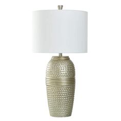 a lamp with a white shade on it