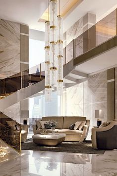 an elegant living room with marble walls and flooring, chandelier in the middle