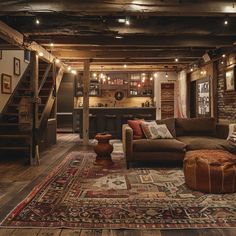 a living room filled with lots of furniture next to a stair case in a house