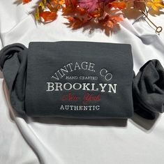 Brooklyn NewYork Authentic embroidered sweatshirt, shop with confidence, our products are made with professional embroidery machines, using hight quality threads.we use white thread on dark color sweatshirts and black thread on light color sweatshirts so the design looks nice!  please send me a message if you want different thread color! Depending on availability we may send jerzees or gildan The sweatshirt also features a classic crew neckline and long sleeves for a timeless look. It's available in a range of sizes and colors, so you're sure to find the perfect one to suit your style. Plus, it's easy to care for, making it the perfect addition to your wardrobe. Product Benefits: * Stylish and fashionable  * Comfortable and warm * Unique embroidered pattern * Classic crew neckline * Easy t Fall Letter Embroidery T-shirt For Streetwear, Gray Embroidered Logo Sweatshirt For Fall, Gray Embroidered Text Sweatshirt For Fall, Brooklyn Newyork, New York Vintage, Embroidery Gifts, Embroidered Crewneck, Black Thread, Embroidered Sweatshirt