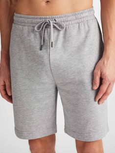 Seen here in a classic silver, our Quinn sweat shorts ensure all-day-long comfort. Featuring a combined elastic and tie waistband, our sweats also feature two front side pockets and a zipped back pocket to keep your phone and essentials close whilst you're out and about. Stylish, yet practical. The Quinn fabric combines all the key qualities of our cotton and micro modal; it's durable and has great colour retention, meaning it can withstand long-lasting wear and won't fade in colour. It's thermo Short Gown Dress, Cashmere Loungewear, Holiday Capsule Wardrobe, Mens Sweat Shorts, Cotton Dressing Gown, Silk Dressing Gown, Long Gown Dress, Merino Sweater, Casual Vest