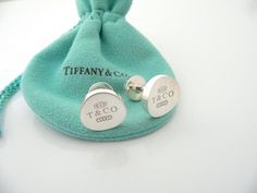 Overview: Offered for sale is a pair of classic and super cool Tiffany and Co. Sterling Silver 1837 Concave Cuff Links.   Beautiful piece of "jewelry" that every man or woman can appreciate! Perfect surprise for that someone special!  The pair is in excellent condition!  The links are fully hallmarked and guaranteed to be 100% authentic.You will not regret purchasing these! :)It will come with its Tiffany pouch as shown! Perfect and ready for gifting!Wonderful present for yourself or anyone you Luxury Engraved Cuff Jewelry, Luxury Sterling Silver Cufflinks, Sterling Silver Jewelry With Palladium Hardware As Gift, Designer Cuff Jewelry For Anniversary, Luxury Sterling Silver Cufflinks For Gift, Luxury Engraved Cufflinks For Gift, Luxury Engraved Cufflinks As Gift, Designer Silver Cufflinks Gift, Luxury Oval Cufflinks As Gift