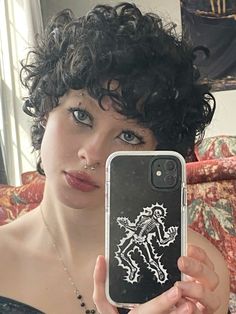 girl selfie mirror photography inspo spring fashion accessories indie aesthetic alt looks subtle eyeliner simple makeup ideas dark curly hair hairstyles poses easy outfits Alt Hair Curly, Alt Hairstyles For Curly Hair, Kawaii Short Curly Hairstyles, Curly Alt Hairstyles, Short Curly Alt Hairstyles, Dark Curly Hair, Mirror Photography, Indie Hair, Indie Aesthetic