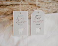 two tags that say happy dental assistant week