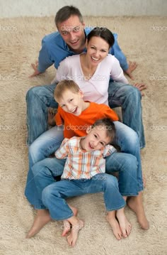 a happy family sitting on the floor together