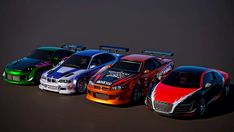 five different colored sports cars lined up in a row on a black background, with one car painted orange and the other blue